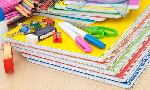 materials needed for school on the desk light wood